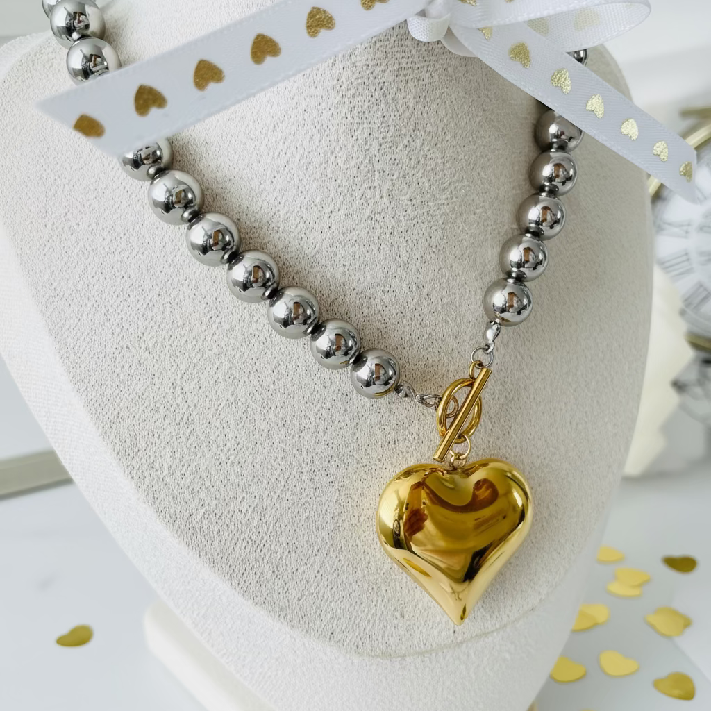 Collar moderno chunky plateado y dorado con corazón, joyería Vanytel